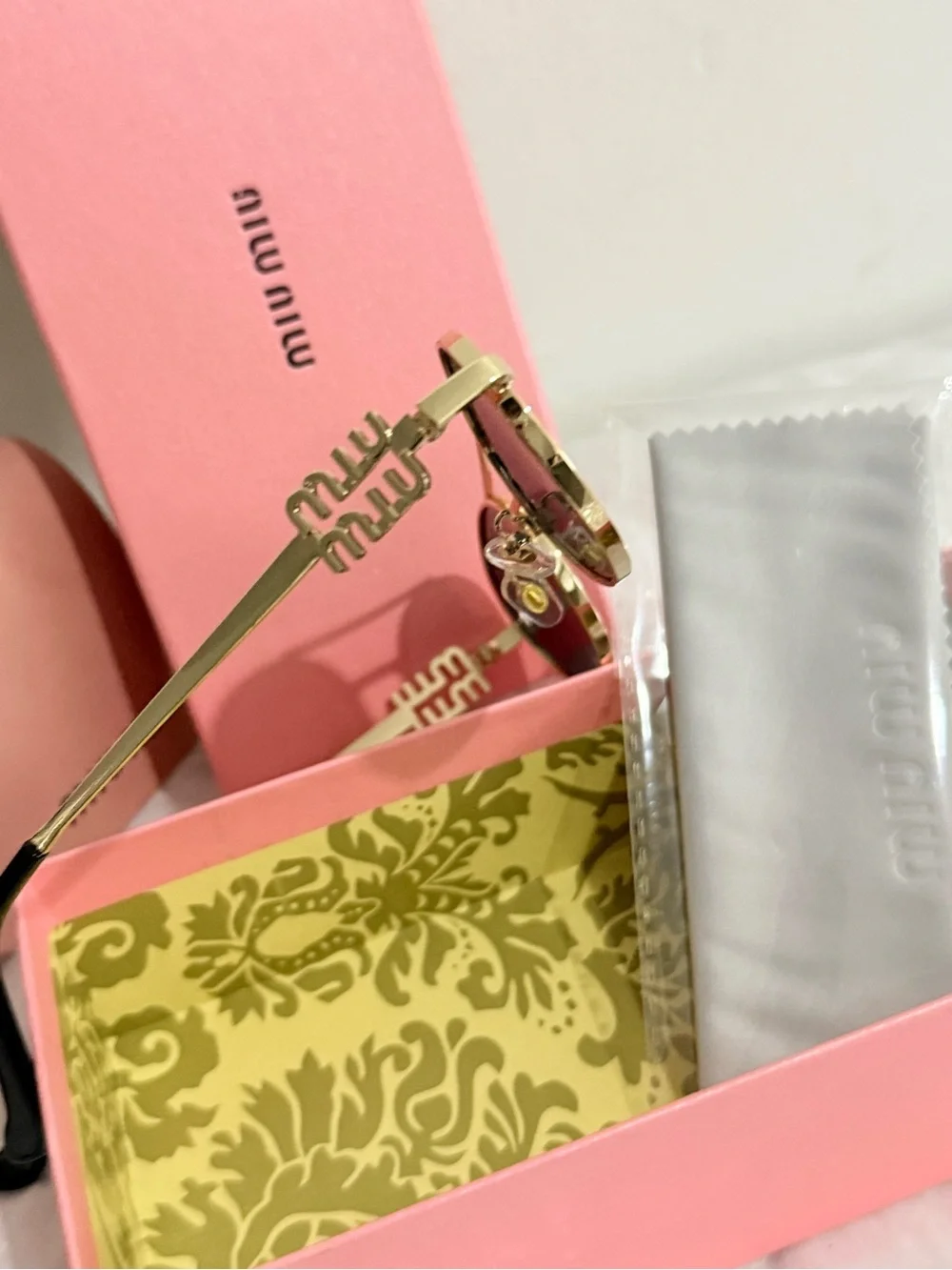 Miu Miu Gold Frame Black Lens Sunglasses with Pink Case